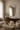 Nerra mirror in a living room reflecting sheer curtains and daylight