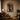 Versailles mirror full room view with chandelier and living room seating