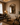 Versailles mirror wide living room view with curtains and armchair