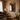Versailles mirror wide living room view with curtains and armchair
